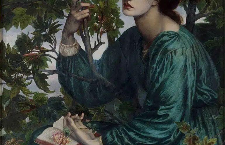 Jane Morris ritratta tra foglie e libri, simbolo del legame tra arte, natura e conoscenza nel Preraffaelismo.